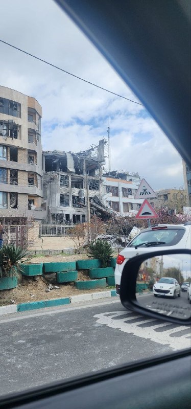 'ساختمانی که حدود ساعت ۲۳ دیشب در جنت‌آباد #تهران هدف قرار گرفت. از دید لاله غربی'تصاویر دریافتی از شهروندان، یکشنبه ۹ فروردینVahid📡 @VahidOnline'ساختمانی که حدود ساعت ۲۳ دیشب در جنت‌آباد #تهران هدف قرار گرفت. از دید لاله غربی'تصاویر دریافتی از شهروندان، یکشنبه ۹ فروردینVahid📡 @VahidOnline